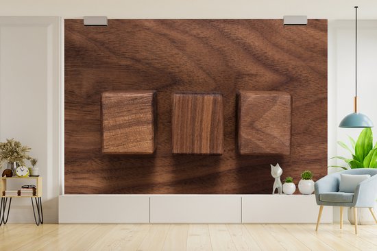 Cubes en bois sur un fond en bois fotobehang