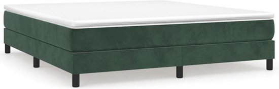 Donkergroen bed met witte matras en zwarte poten.