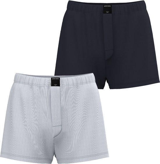 Twee Björn Borg boxershorts. Een in donkerblauw, de ander met fijne witte krijtstreep. Beide met label.