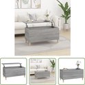 Grijze salontafel met houtnerf en opklapbaar blad, op houten pootjes, met decoratie.