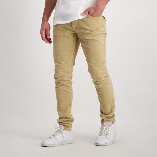 Voorkant van beige corduroy jeans, met steekzakken en knoopsluiting.