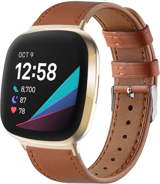 Montre connectée dorée avec un bracelet en cuir marron. L'écran affiche "OCT 9 12:58" et diverses icônes.