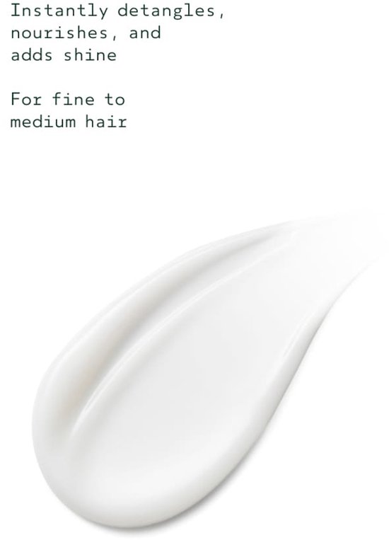 Textuur van witte conditioner die glans toevoegt aan fijn tot medium haar.