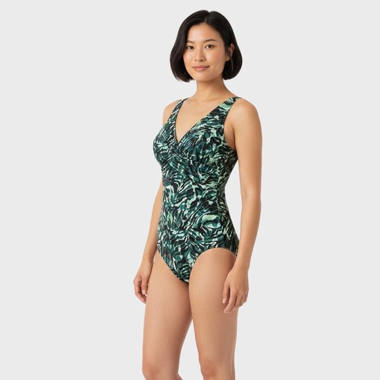 Dames badpak met v-hals en tropische print in groen en zwart.