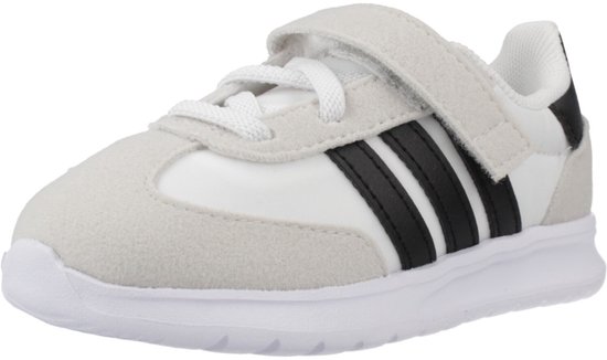 Witte sneaker met zwarte strepen, suède neus en klittenbandsluiting.
