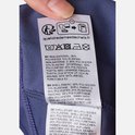 Kledinglabel met wasinstructies in meerdere talen.