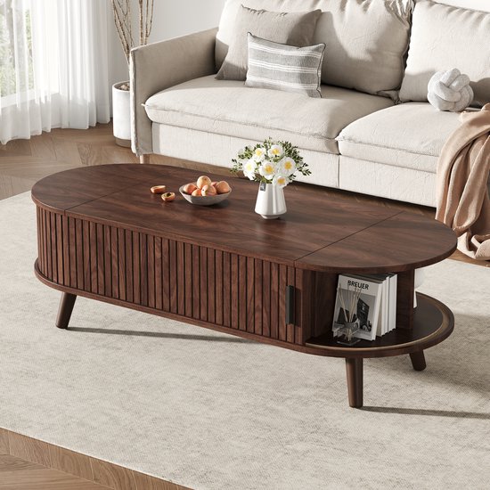 Donkerbruin ovale salontafel met ribbelpatroon, opengeklapt tafelblad en bijkeukenelementen.
