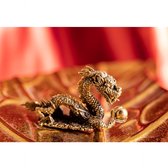Dragon couché miniature en laiton