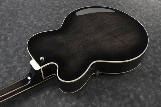 Achterkant van de zwarte semi-akoestische Ibanez basgitaar, met zichtbare houtnerf en witte binding.