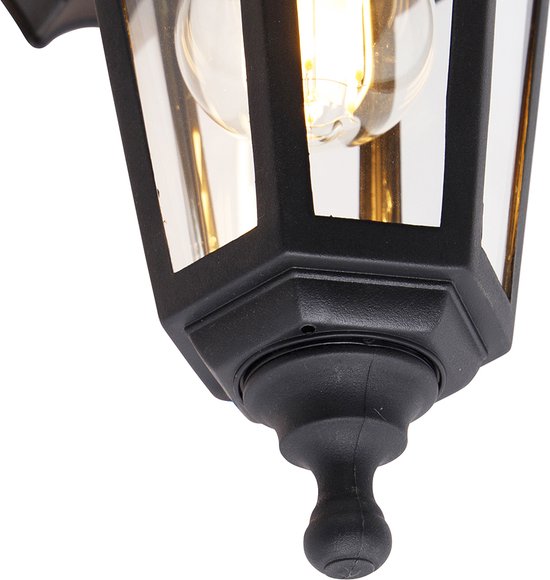 Close-up van de zwarte wandlamp, detail van het voeteinde met bol.
