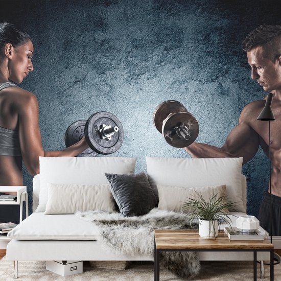 Fotobehang Gespierde Man Een Atletische Vrouw - Vliesbehang - 416 x 254 cm