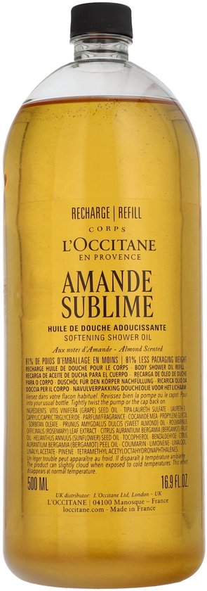 L'Occitane Amande Sublime doucheolie refill fles met goudgele olie. Tekst: AMANDE SUBLIME, HUILE DE DOUCHE ADOUCISSANTE.