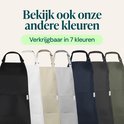 Sept tabliers de cuisine de différentes couleurs : noir, blanc, beige, gris, marine et vert.