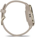 Zijprofiel van een lichtbruine smartwatch met gouden sluiting.