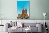 Canvas Schilderij Sagrada Familia bij een vroege zonsondergang in Barcelona - 80x120 cm - Wanddecoratie