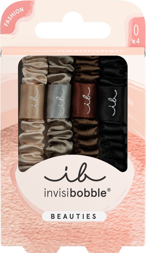 Verpakking met vier Invisibobble haarelastieken in neutrale tinten: beige, grijs, bruin en zwart. Op elk elastiek staat 'ib'.