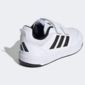 Witte kindersneakers met klittenbandsluiting, zwarte strepen op de zijkant, achterkant en zool.