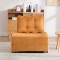 Oranje corduroy slaapfauteuil dichtgeklapt, met grote wigvormige rugkussen.