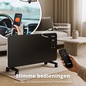 Zwarte FlinQ convectorkachel op wielen, bediend via smartphone en afstandsbediening.