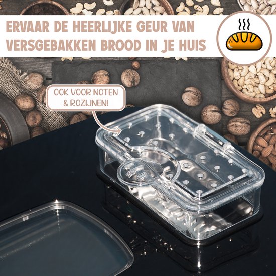 Transparante dispenser voor noten en rozijnen, naast een broodmachine, met diverse noten eromheen.