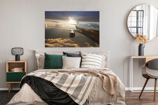 Un avion à réaction survole les nuages Poster 120x80 cm - Tirage photo sur Poster (décoration murale salon / chambre)