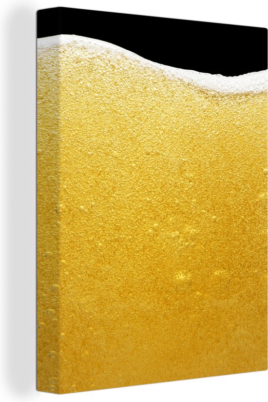 Tableau sur toile Gros plan d'un verre de bière avec de la mousse - 90x120 cm - Décoration murale