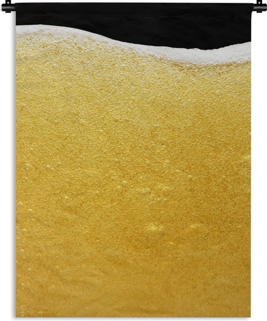 Wandkleed Bier - Close-up van een glas bier met schuim Wandkleed katoen 90x120 cm - Wandtapijt met foto
