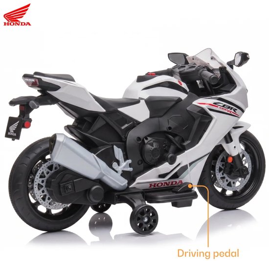 Witte Honda CBR 1000RR elektrische kindermotor met rijpedaal, deels van de zijkant gezien.