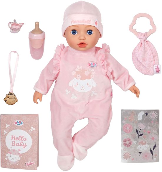 Baby Annabell pop met roze pyjama, muts en accessoires: fles, fopspeen, rammelaar, boekje en stickers.