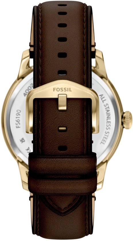 Gouden gesp op bruin lederen Fossil horlogeband.
