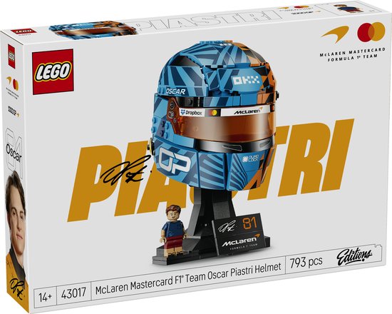 LEGO verpakking met McLaren F1 helm, oranje en blauw, met "PIASTRI" en "Oscar" erop.