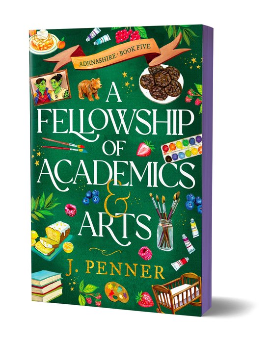 Boek "A Fellowship of Academics & Arts" van J. Penner, deel vijf van Adenashire. Groene omslag met illustraties van kunstbenodigdheden, fruit en gebak.