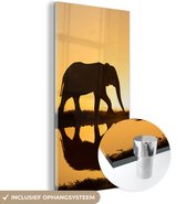 MuchoWow® Glasschilderij 20x40 cm - Schilderij acrylglas - Silhouet van een olifant bij zonsondergang - Foto op glas - Schilderijen