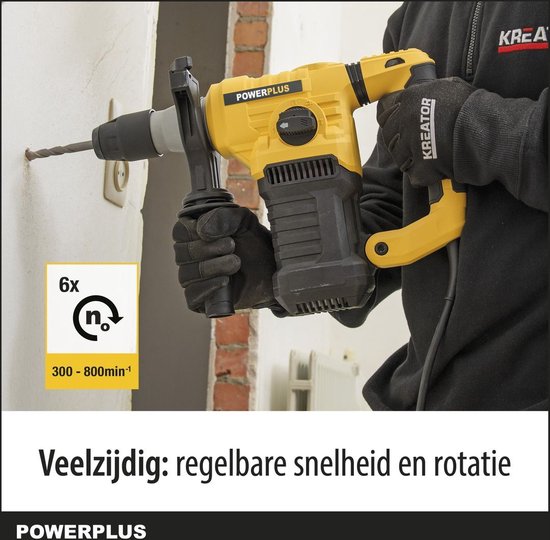 Gele Powerplus klopboormachine in gebruik om muur te boren. Veelzijdig: regelbare snelheid en rotatie.