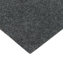 Coin d'un tapis gris foncé chiné