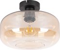 Een amberkleurige glazen plafondlamp met een zwarte basis.