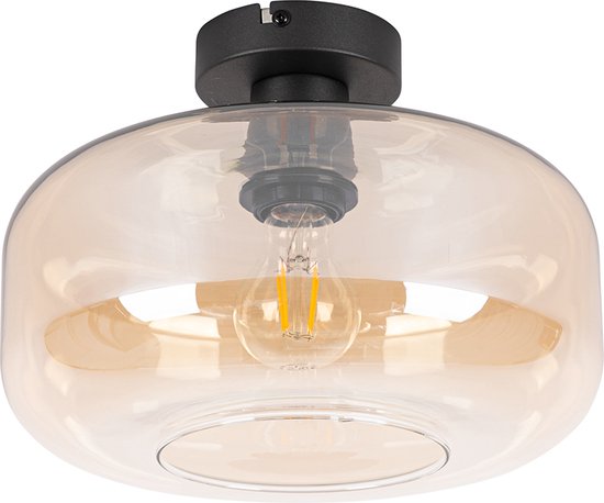 Een amberkleurige glazen plafondlamp met een zwarte basis.