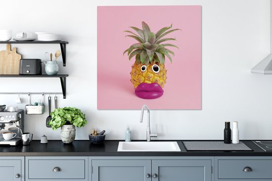 pineapple with face made of fake lips and googly eyes