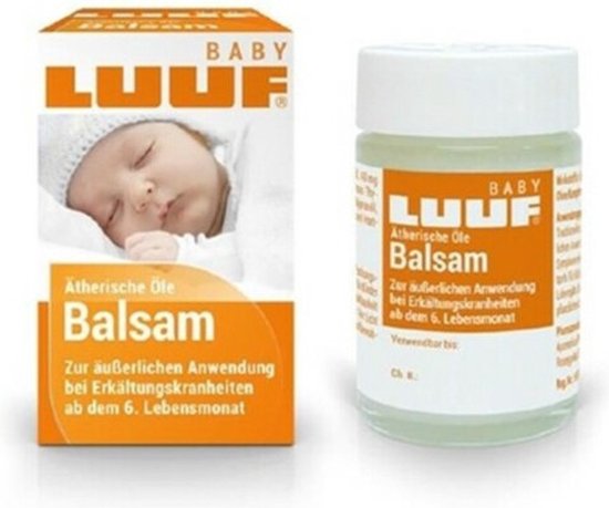 Luuf baby verkoudheidsbalsem. Baby op de verpakking, met potje balsem ernaast. Etherische olie balsem, vanaf 6 maanden.