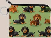 Facile à avoir, ce portefeuille zippé pratique avec porte-clés 12x10cm et une jolie image de chiens/teckels. Très agréable à acheter pour soi ou à offrir en cadeau, par exemple à l'occasion de Sinterklaas ou de Noël.