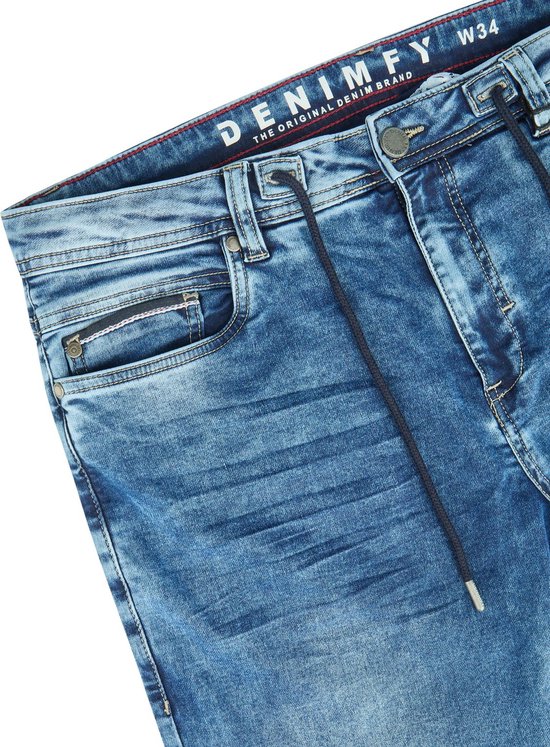 Close-up van de tailleband van een blauwe DENIMFY spijkerbroek met trekkoord.