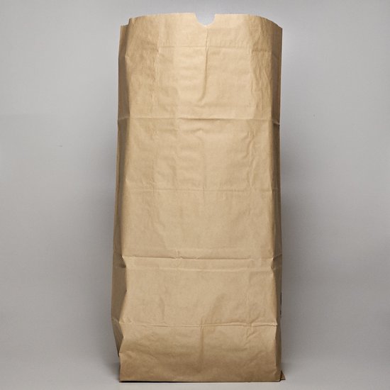 Sac poubelle en papier brun de 60 litres, debout.