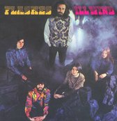 Vijf personen in psychedelische kleding, met de tekst "FLASHES" en "ILL WIND".