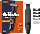 Gillette Fusion One Hybride Trimmer verpakt in een doos met accessoires. Trimmer en accessoires zijn zwart.