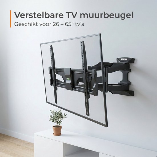 Verstelbare zwarte tv-muurbeugel voor 26-65" tv's, bevestigd aan een witte muur naast een kast en plant.