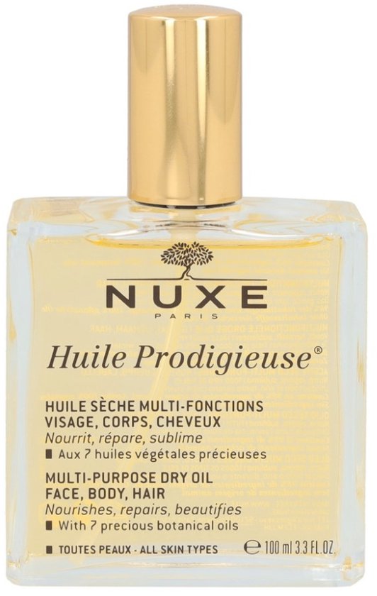 Rechthoekige glazen fles Nuxe Huile Prodigieuse dry oil met gouden dop, op een witte achtergrond.