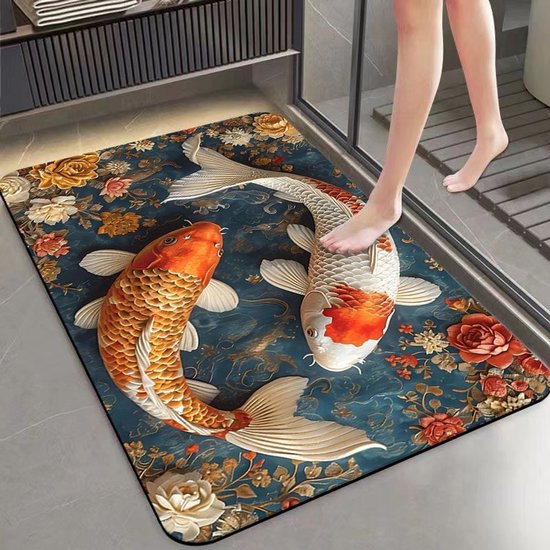 Een badmat met een ontwerp van twee koi vissen, één oranje en één wit, op een blauwe achtergrond met bloemen.