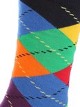 Detail van een donkerblauwe Happy Socks met grote turquoise, blauwe, witte en oranje stippen.