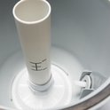 Binnenzijde van een zandfilterpomp met min/max-aanduiding op een witte buis.