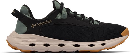 Chaussure de randonnée Columbia noire avec accents vert menthe, semelle beige perforée et boucle arrière.